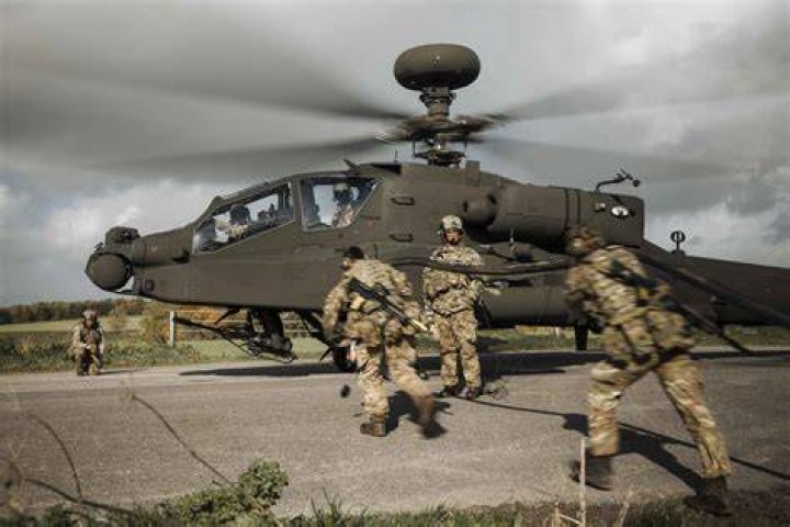 How many people can an Apache helicopter hold