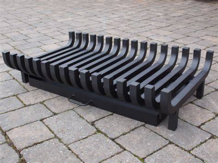 What is the purpose of a grate in a fireplace